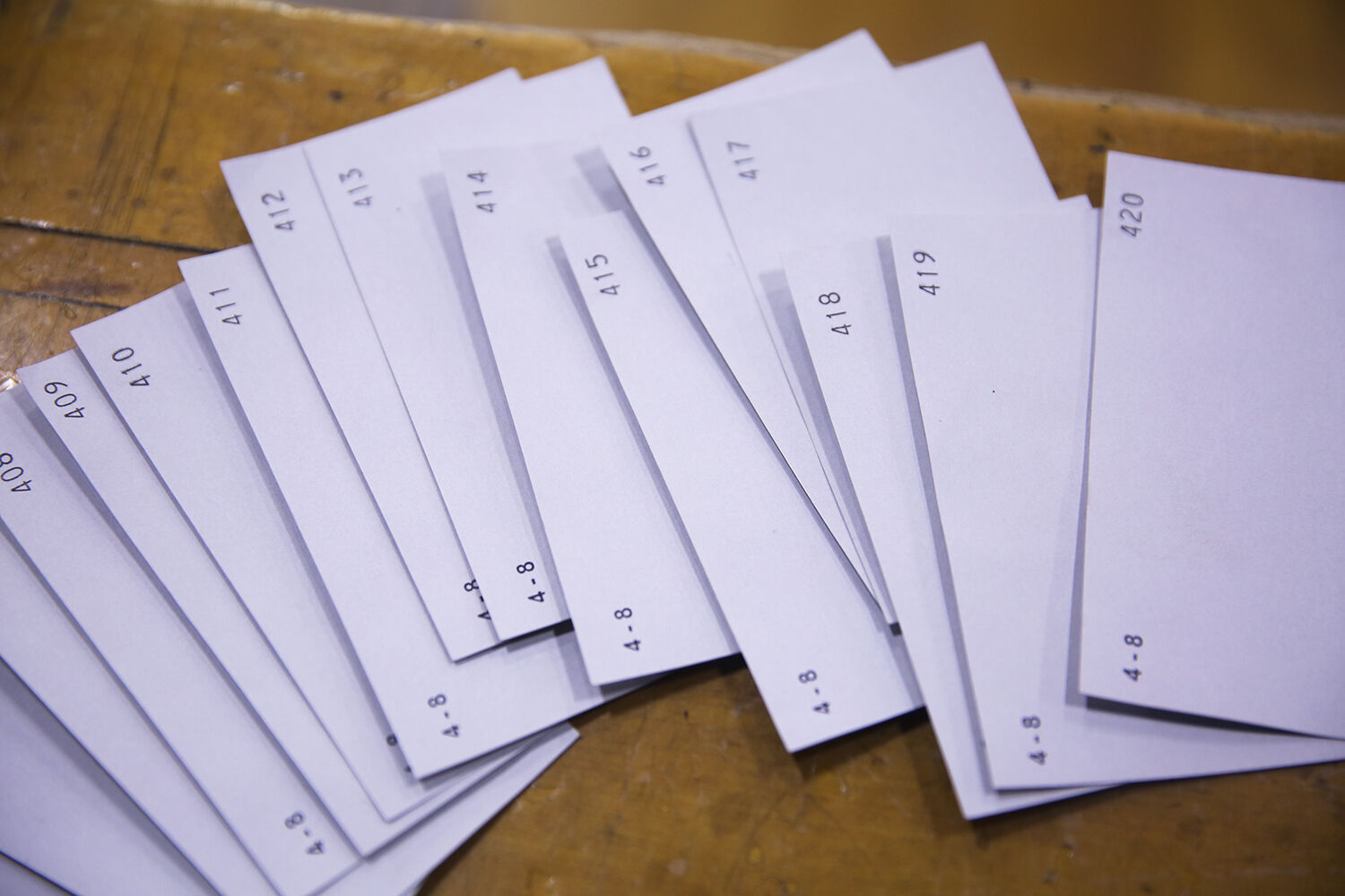Voter number cards lay on the stage after being turned in